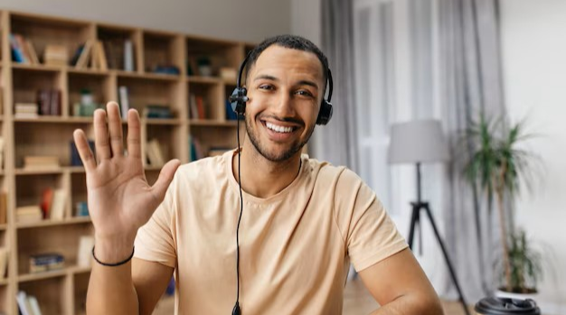 A driver waving on a video intro call